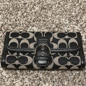 Black and silver coach wallet